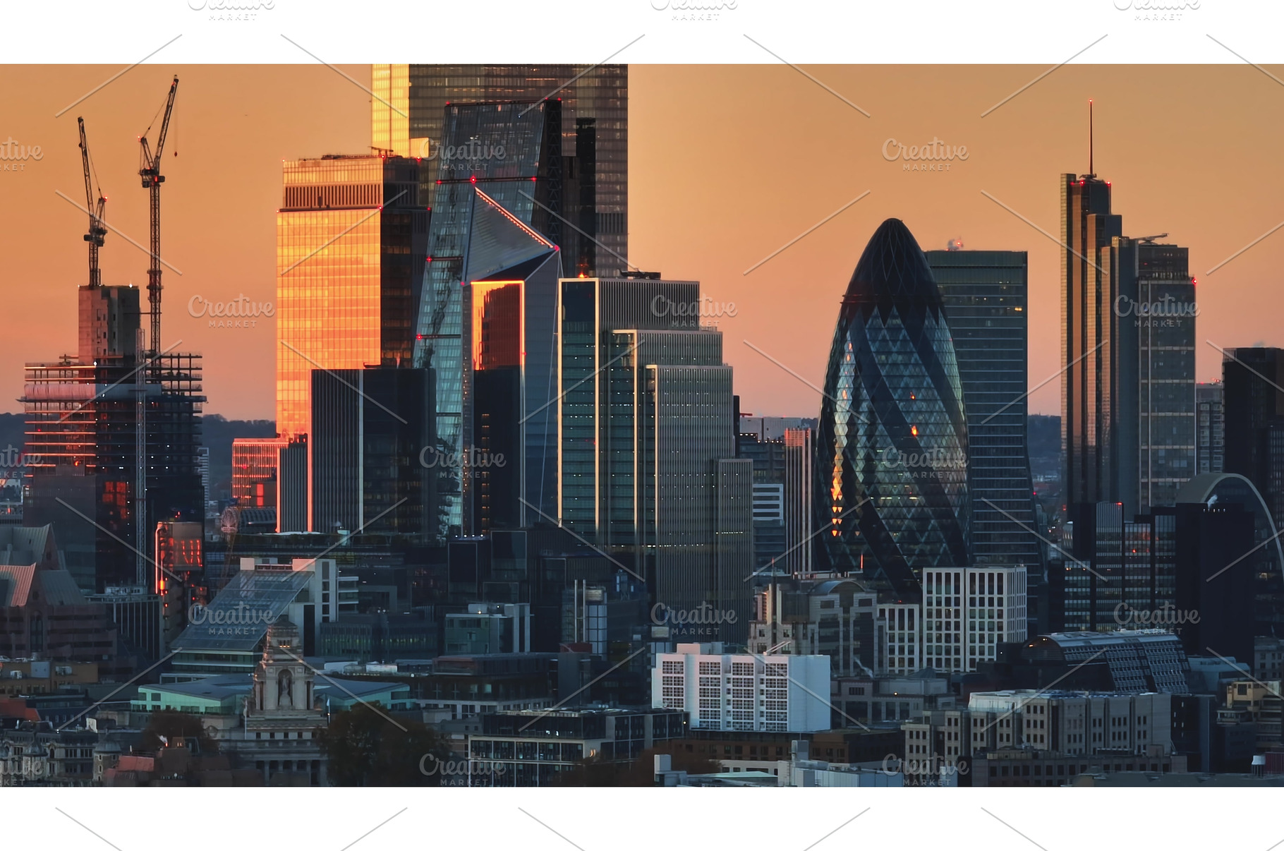 London skyline reflecting orange, an Architecture Photo by Goinyk