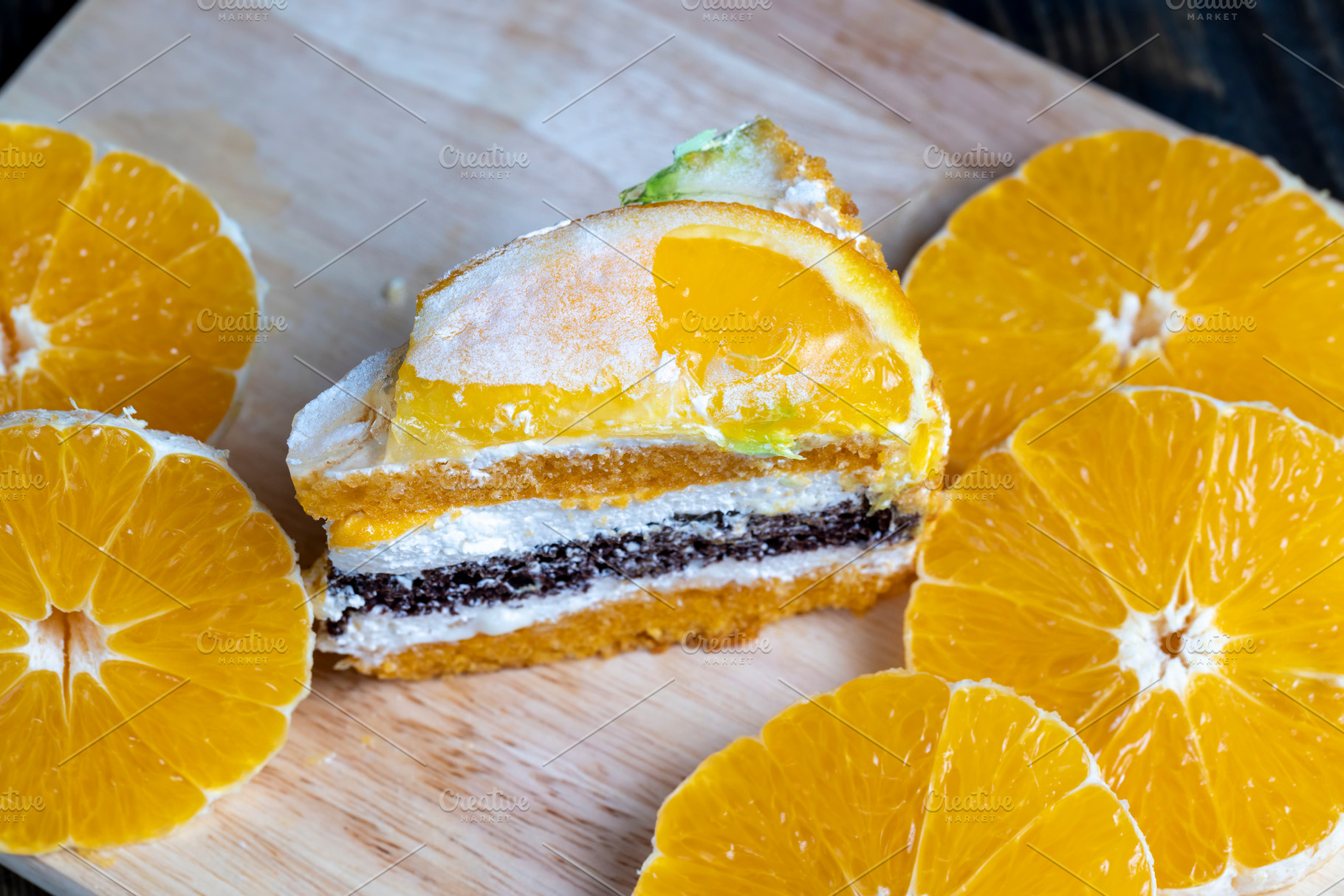 sliced fresh oranges and a piece of orange dessert, a Food & Drink Photo by MyPhotos