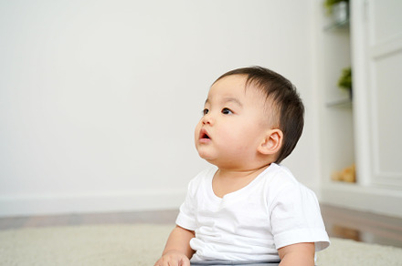 Asian boy sitting on the floor alone containing asian, bed, and boy, a Person Photo by Twinster Photo