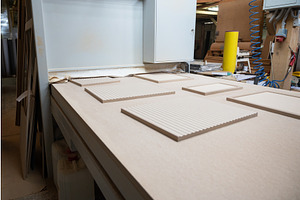 Grinding of wooden furniture panels, a Graphic by Jan Jack Russo Media