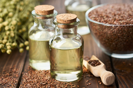 Bottles of linseed oil, flax seeds, a Food & Drink Photo by chamillewhite