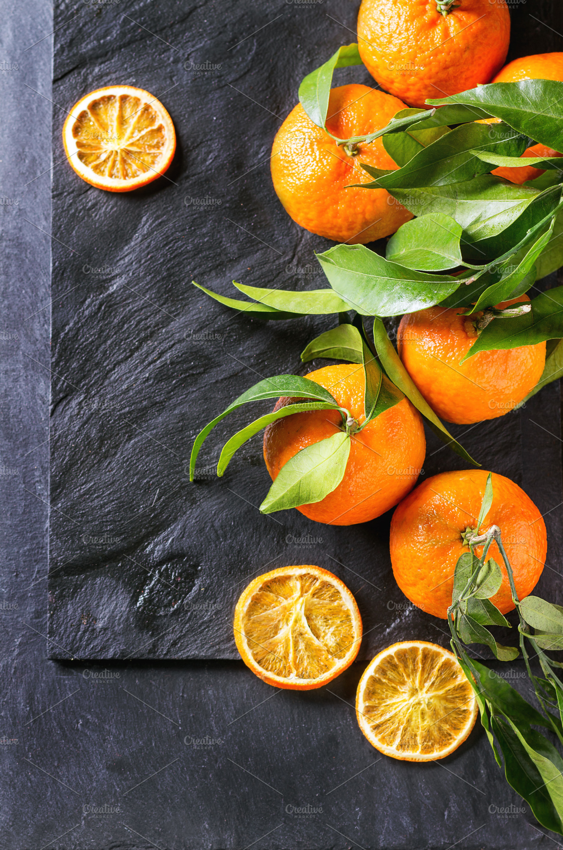 Tangerines with leaves featuring tangerine, food, and background, a Food & Drink Photo by Natasha Breen