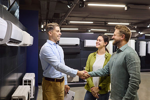 Salesman Shaking Hands with Couple