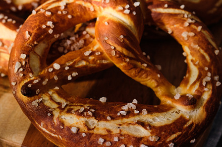 Freshly baked homemade soft pretzel containing pretzel, food, and traditional
