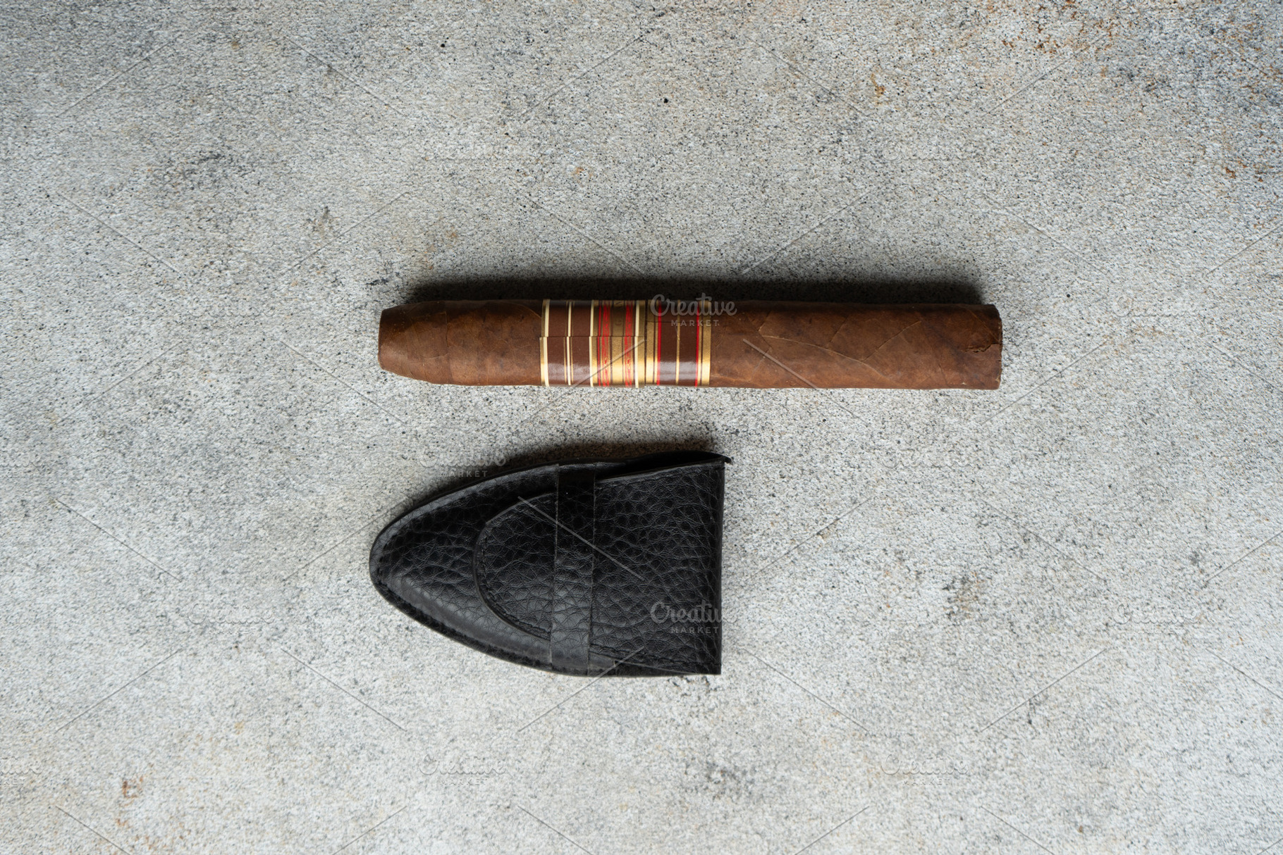 Cuban cigar on the stone table, a School & Education Photo by Anna Bogush