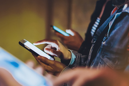 Friends using in hands mobile phone stock photo containing people and blogger