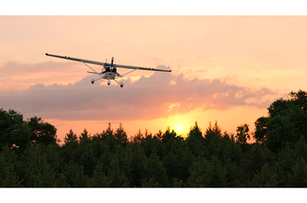 Propeller airplane flying at sunset, a Transportation Photo by adamadam