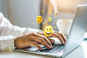 Hand on the keyboard and floating emoticons appear as holographi, a Technology Photo by DanFLCreativo