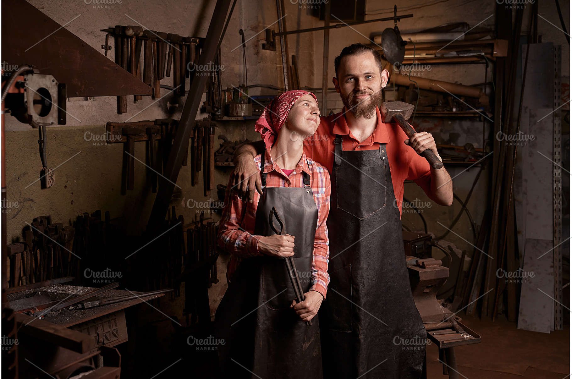 blacksmiths couple with tools in, a Person Photo by Oleksandr Berezko