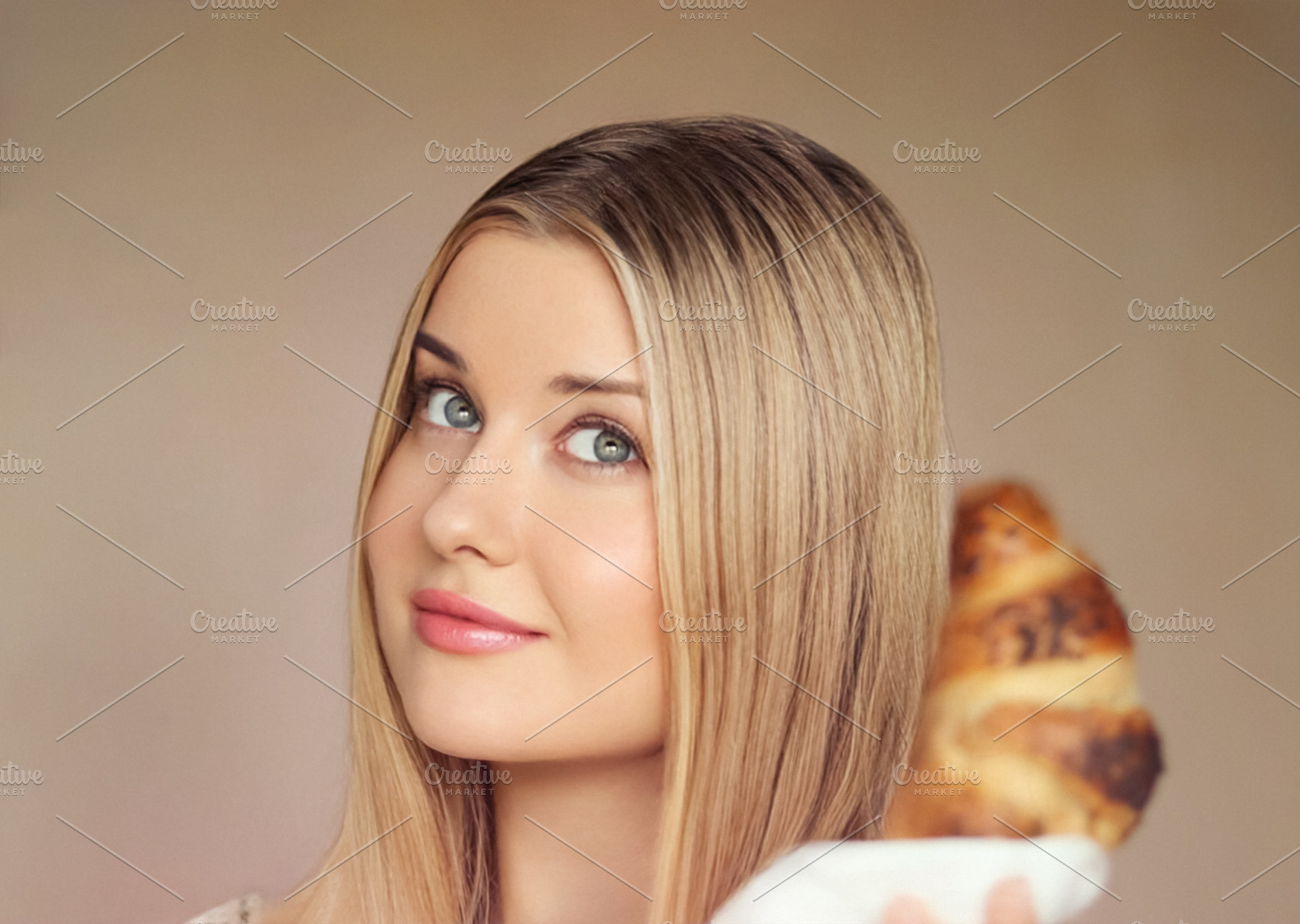 Young blonde woman posing for a portrait, enjoying a fresh crois, a Person Photo by Studio ANNA