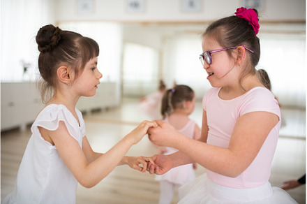 Little disabled girls dancing, a School & Education Photo by HalfPoint
