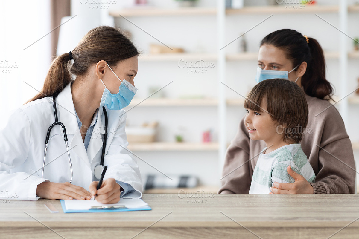 Carefree little boy sitting with mother at clinic and smiling to doctor, woman, a Photo by Prostock-Studio (Photo 2 of 2)
