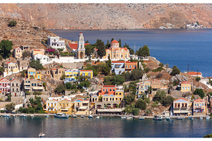 Symi harbor hillside with colorful, an Architecture Photo by kavalenkava