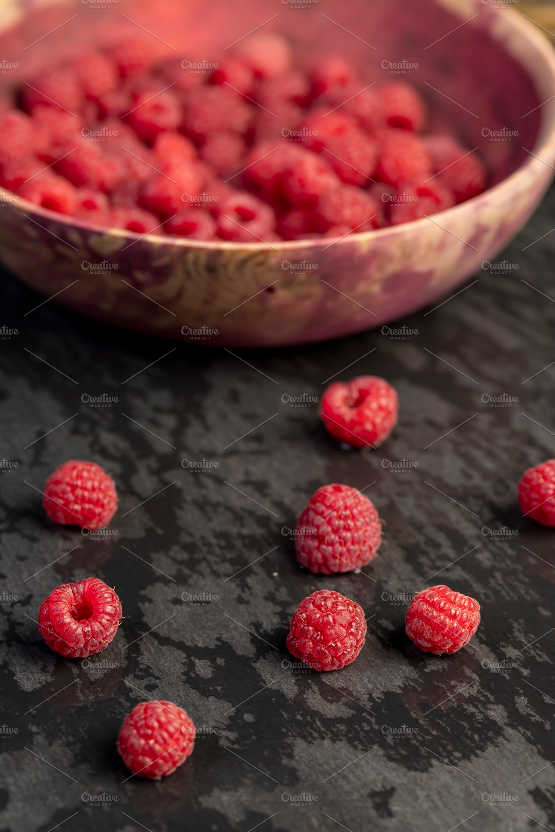 the collected amount of ripe raspberries is red close up, side view, a Photo by rsoollAI