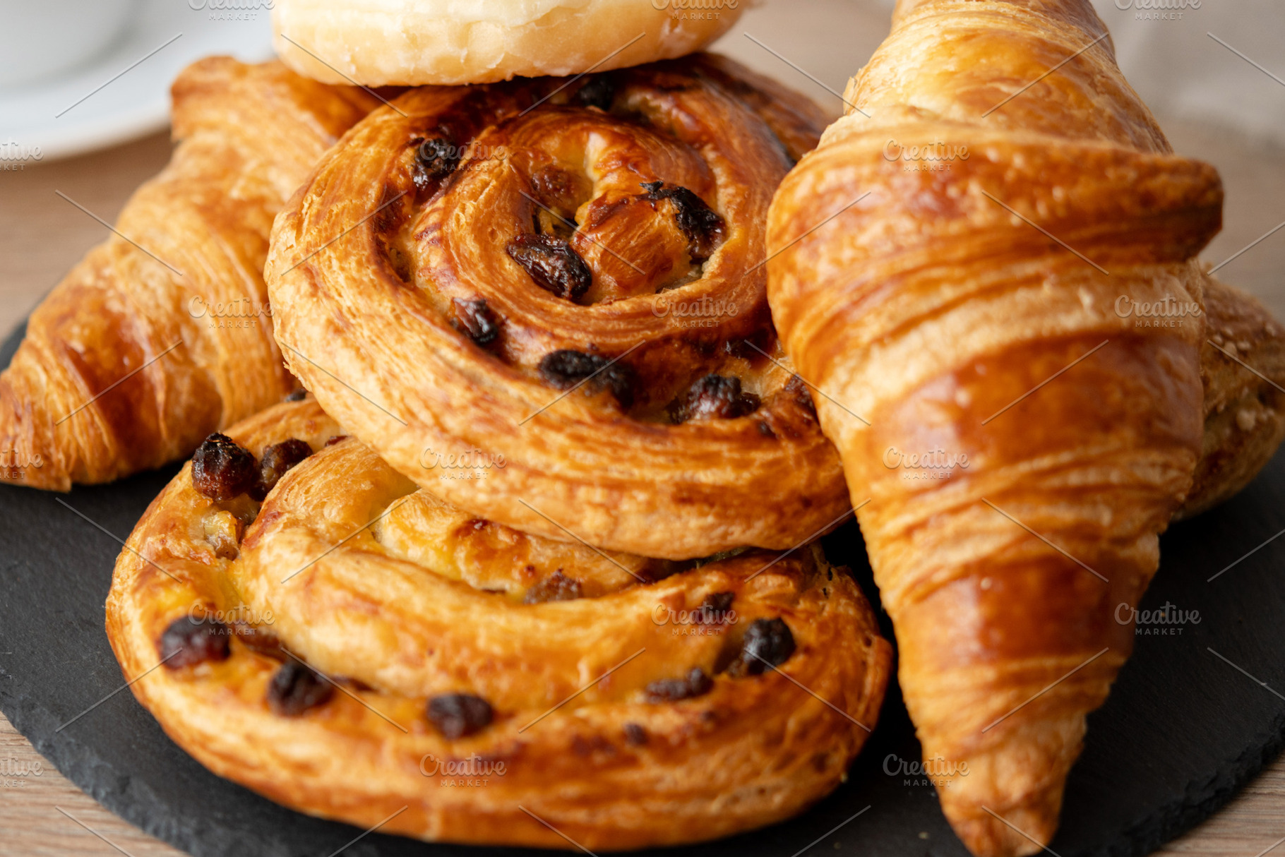 Assortment of Fresh Pastries on wooden table, a Food & Drink Photo by etorres69