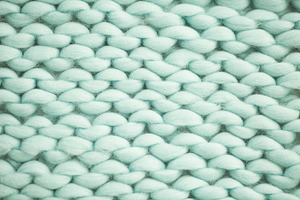 Mint woolen fluffy sweate containing surface, closeup, and clothing