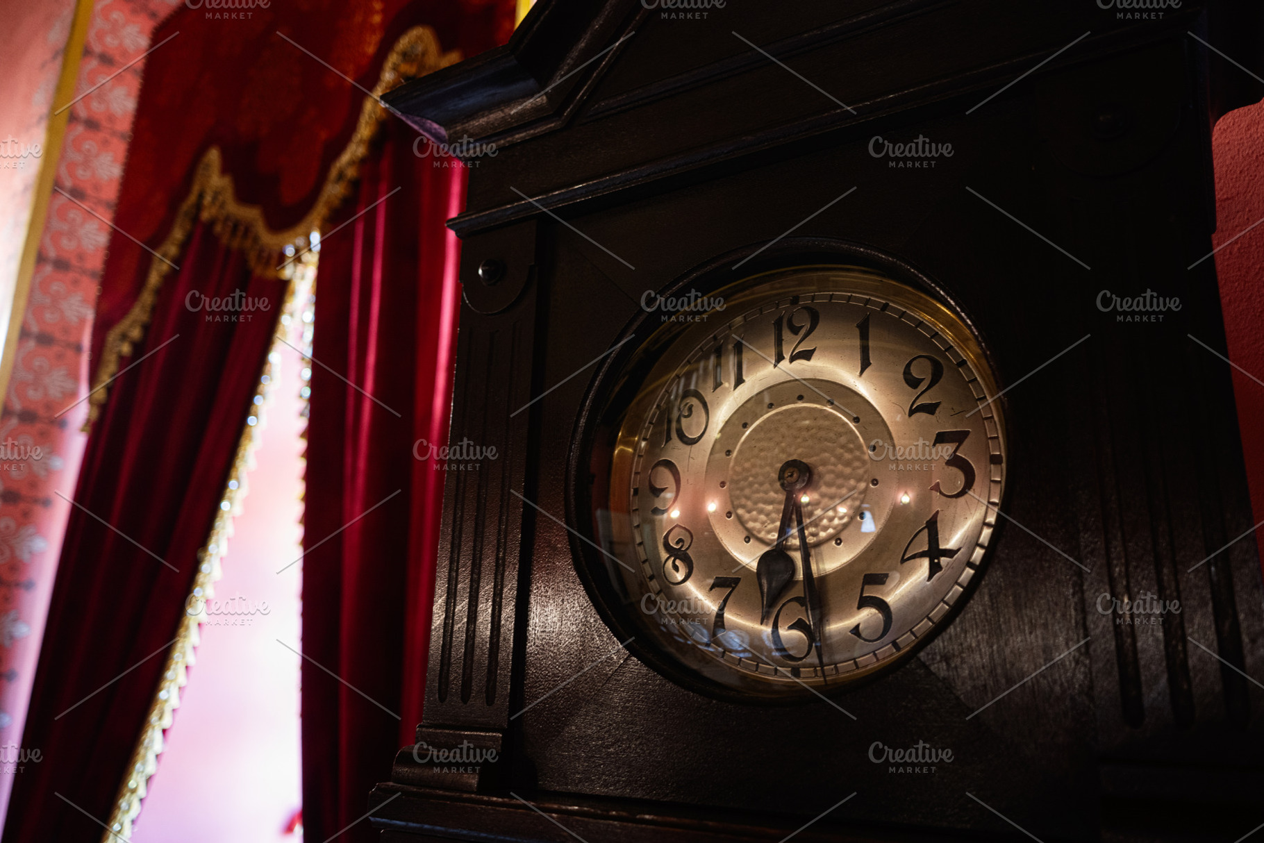 Antique clock in an elegant room with vintage decor and red curtains, a Photo by AS photostudio
