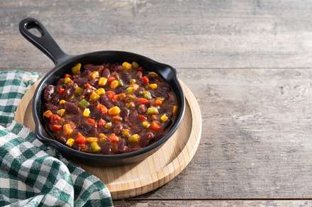 Mexican chilli beans with vegetables in iron pan