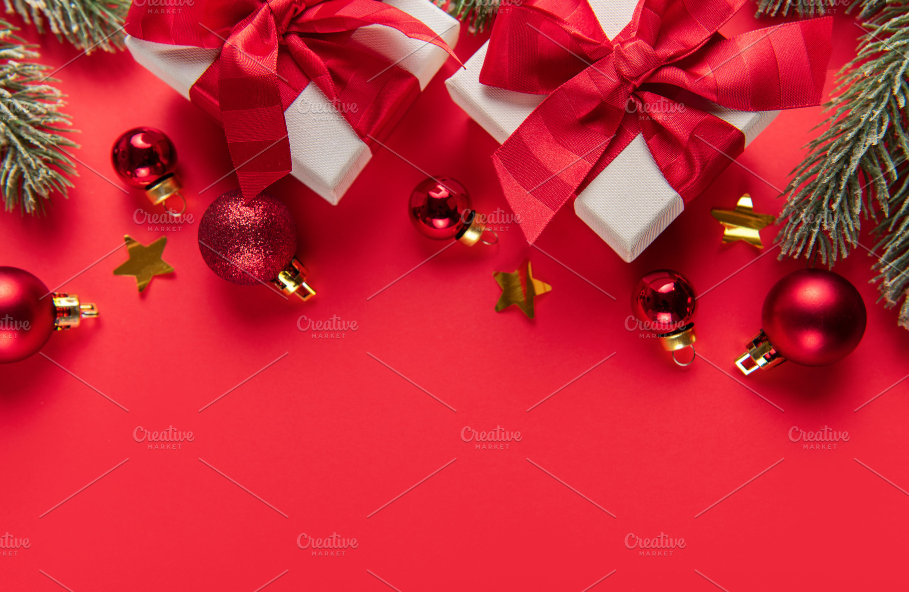 Christmas gifts and ornaments on red background border, a Holiday Photo by Olena Rudo