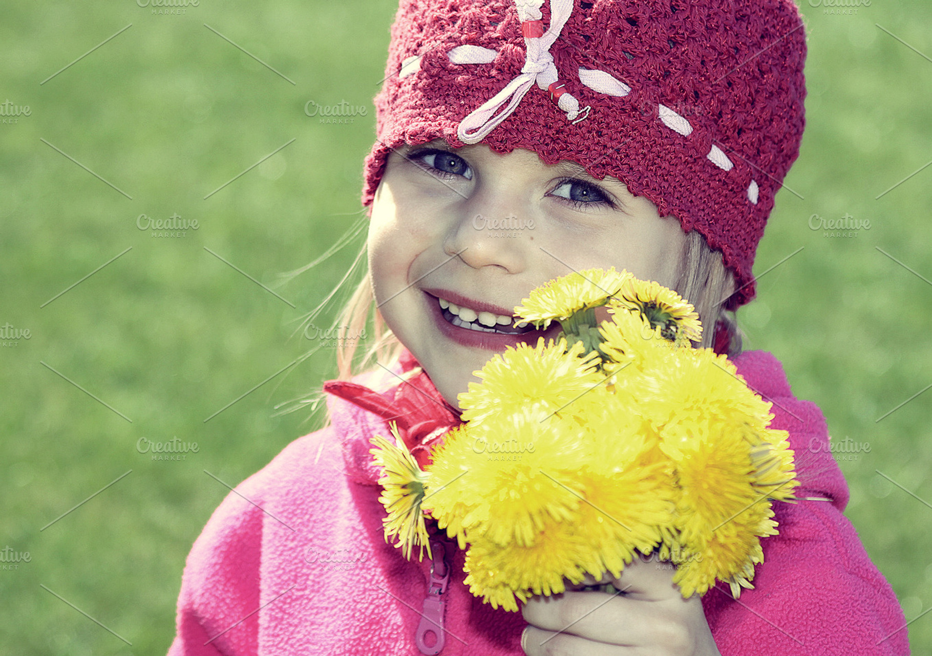 Little girl with yellow flowers, a Person Photo by BOOCYS