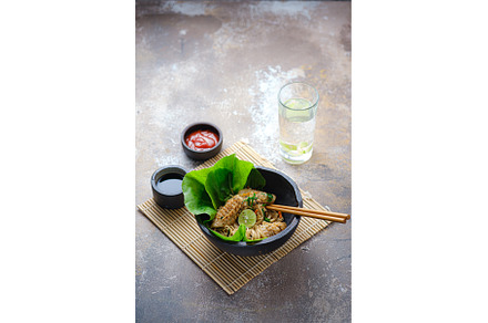 Hot noodles with squid in stone
