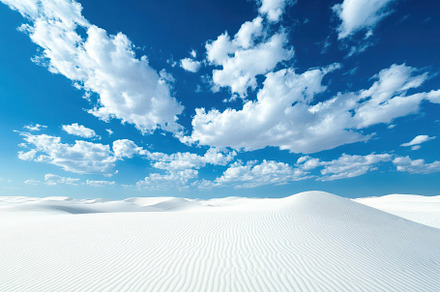 Vast white sand dunes under a bright, a Photo by Iftikhar Alam