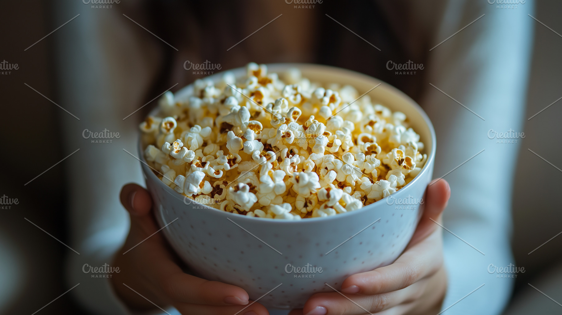 Woman holds bowl full of popcorn, a Food & Drink Photo by MistyDay