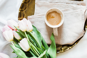 Coffee and Tulips in Bed Stock