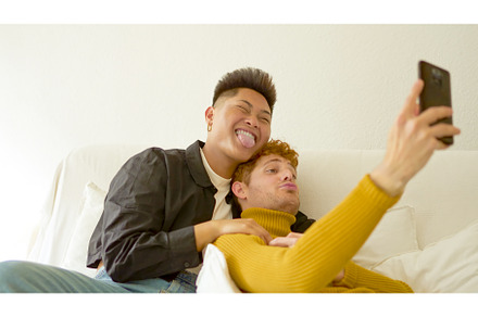 Tender gay couple taking a selfie at, a Person Photo by Iván Moreno STOCK PHOTO