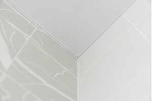 Minimalistic white corner of ceramic, a Background Photo by volodymyrshtun13795