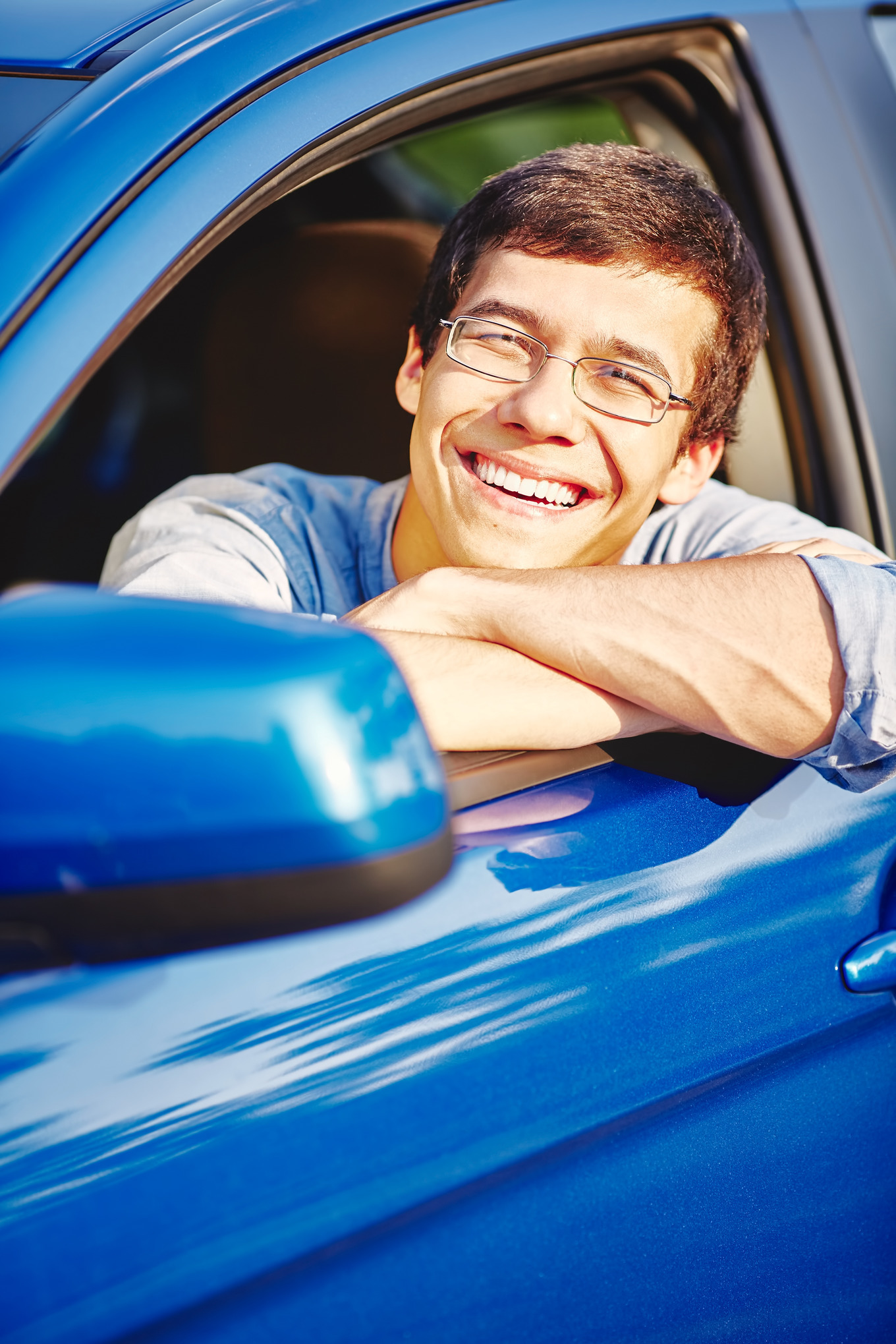 Smiling guy in car, a Transportation Photo by Sergey Furtaev