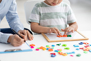 Cute little kid at speech therapist office. Close up of unrecognizable boy lear, a Photo by Prostock-Studio (Thumbnail 1 of 2)