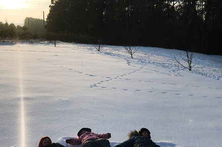 Children enjoying a playful day in the snowy landscape, a Photo by AS photostudio