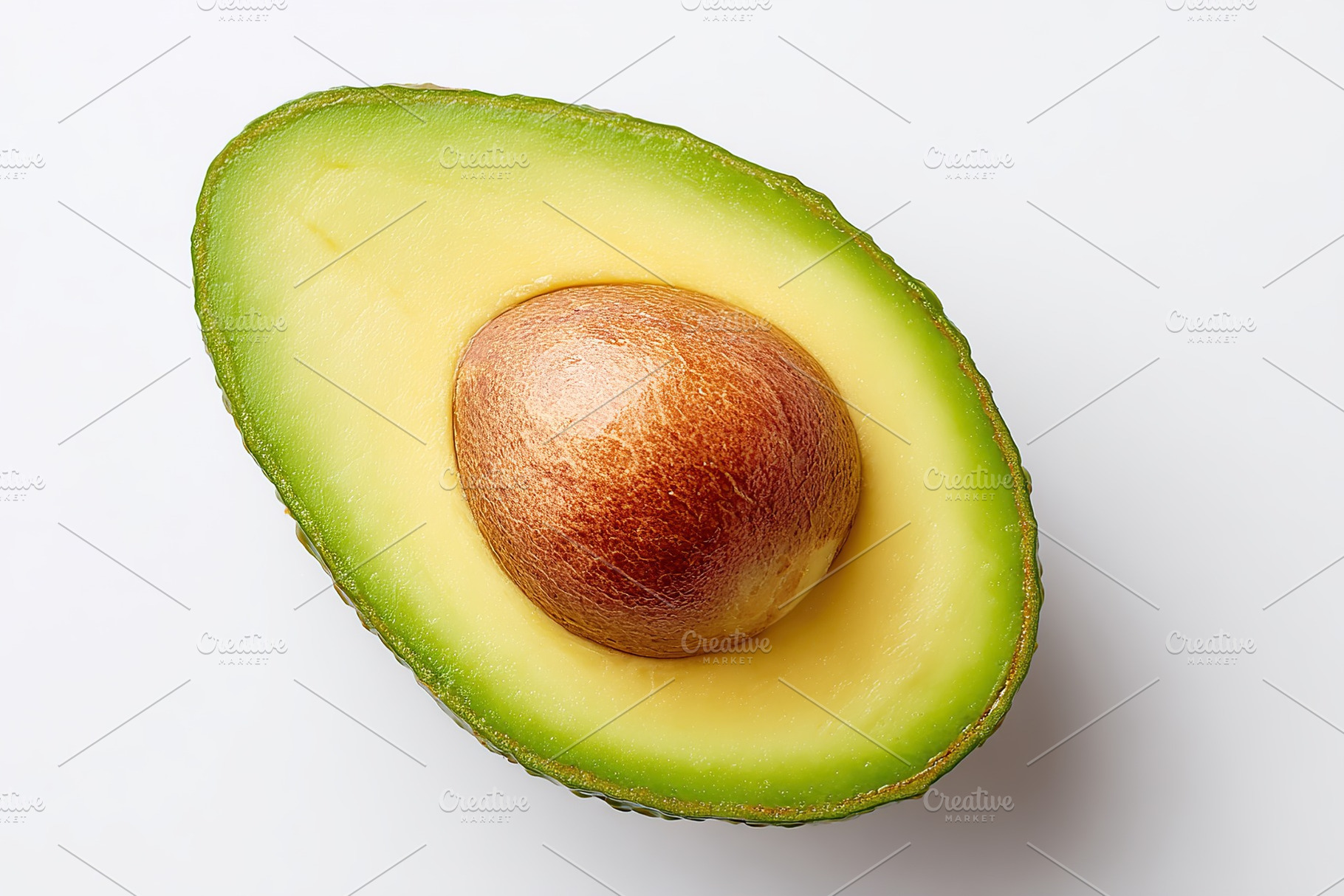 Fresh avocado half with vibrant green flesh and smooth brown pit displayed on a, a Food & Drink Photo by AlyaAnd