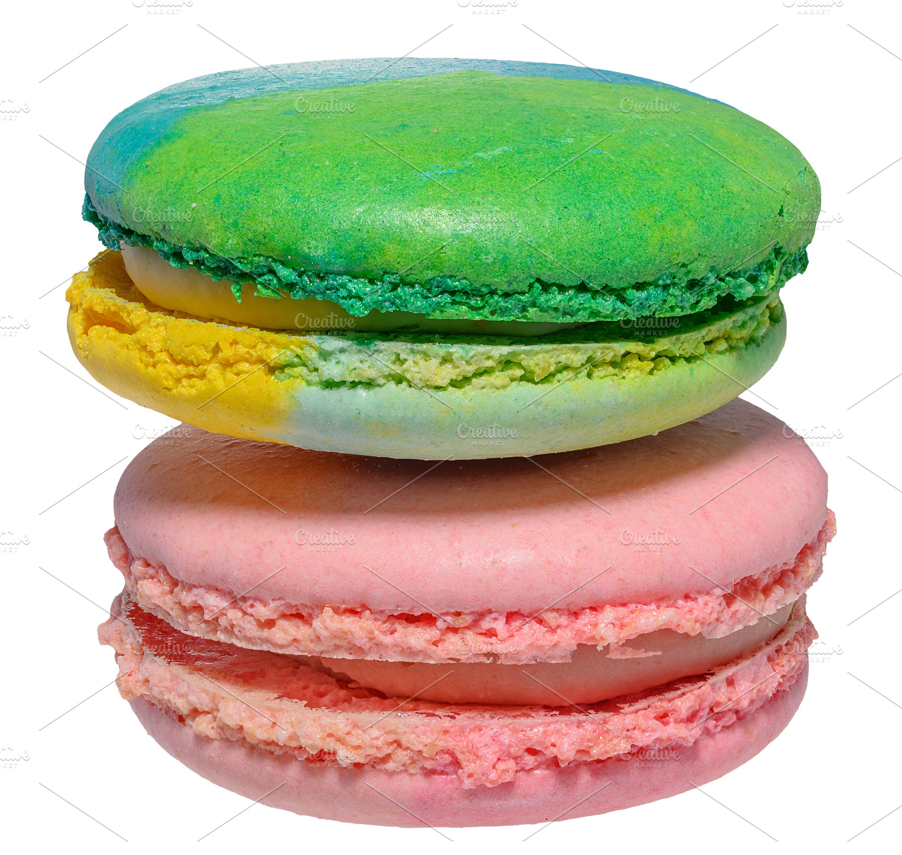 Pink and green macarons on isolated background, close up, a Food & Drink Photo by ndanko