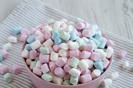 Rainbow Fruity Mini Marshmallows in a Pink Bowl, side view. Copy, a Food & Drink Photo by LiudmylaChuhunova