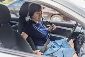 Older woman driving a car with focus, a Transportation Photo by Elizaveta Galitskaya