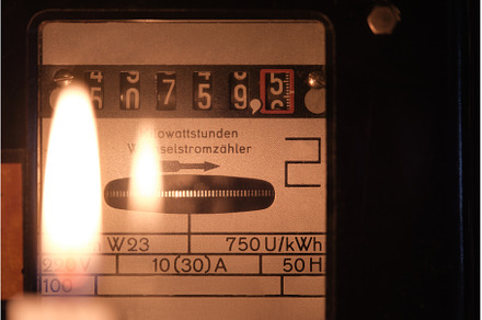 Vintage electric meter with candle, a Technology Photo by tilialucida