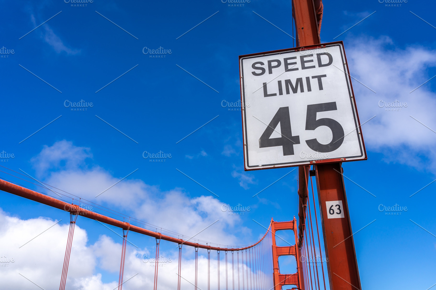 Golden Gate Bridge road view with red suspension cables, San Fra, an Architecture Photo by GoodGoods