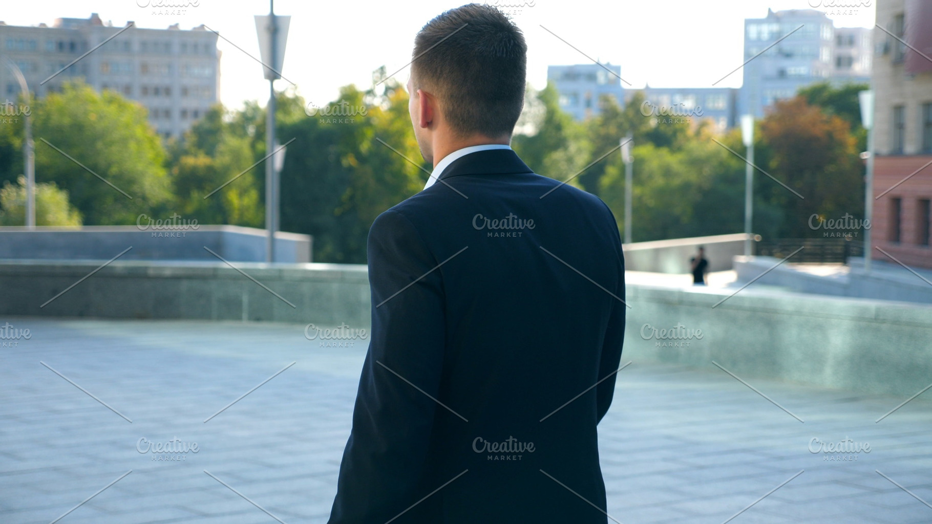 Young businessman with a briefcase featuring street, city, and cityscape, a Person Photo by Footage Autor