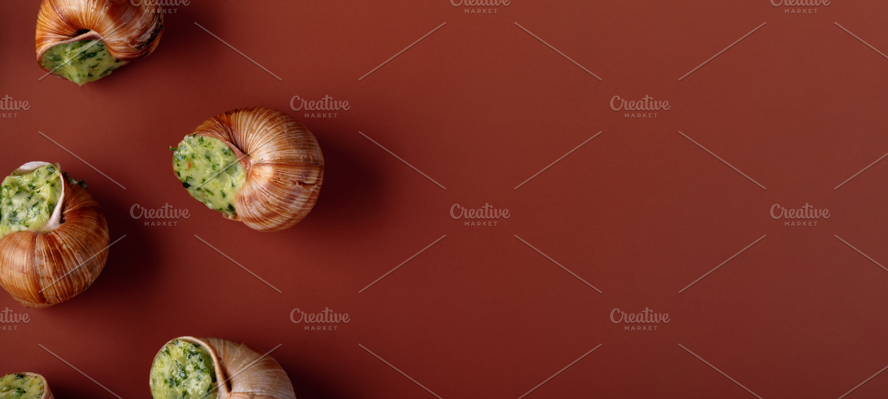 Gourmet escargot in shells with parsley herb butter, arranged on, a Food & Drink Photo by Ales Munt