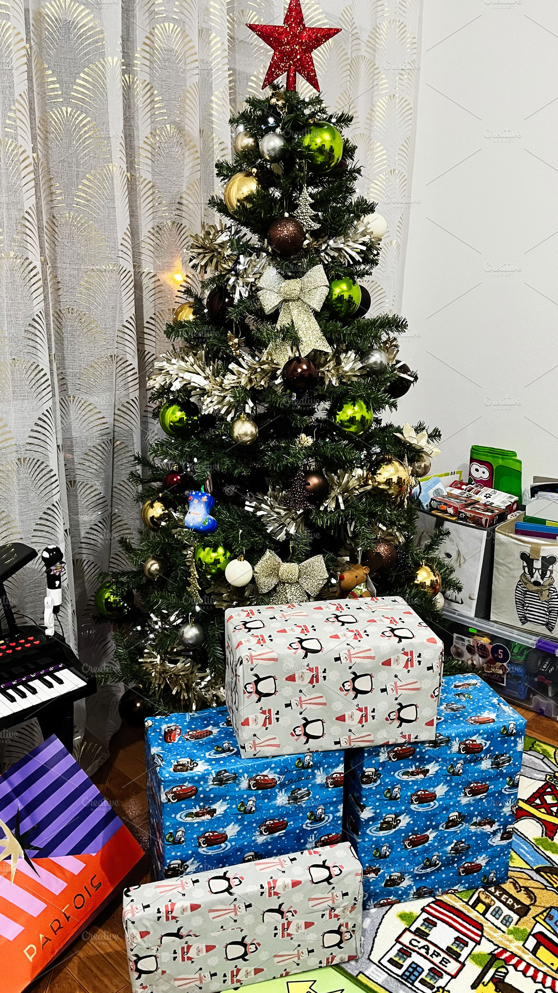 Decorated Christmas tree with wrapped gifts beneath, creating a festive atmosph, a Photo by AS photostudio