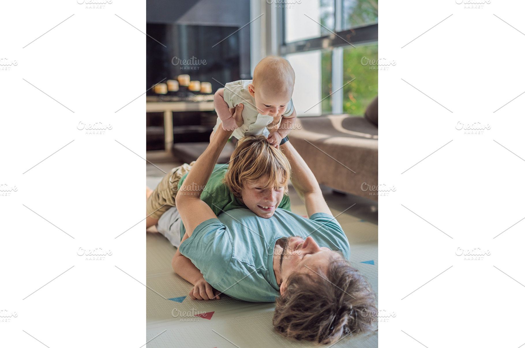 Father, son, and newborn baby lying, a Person Photo by Elizaveta Galitskaya