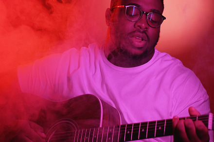 Singing performance man playing song guitar smoke, a Person Photo by Photo Drive Studio