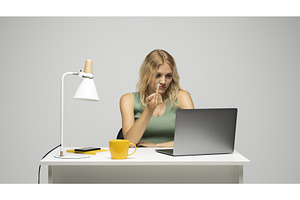 Young blonde woman showing middle, a Technology Photo by volodymyrshtun13795