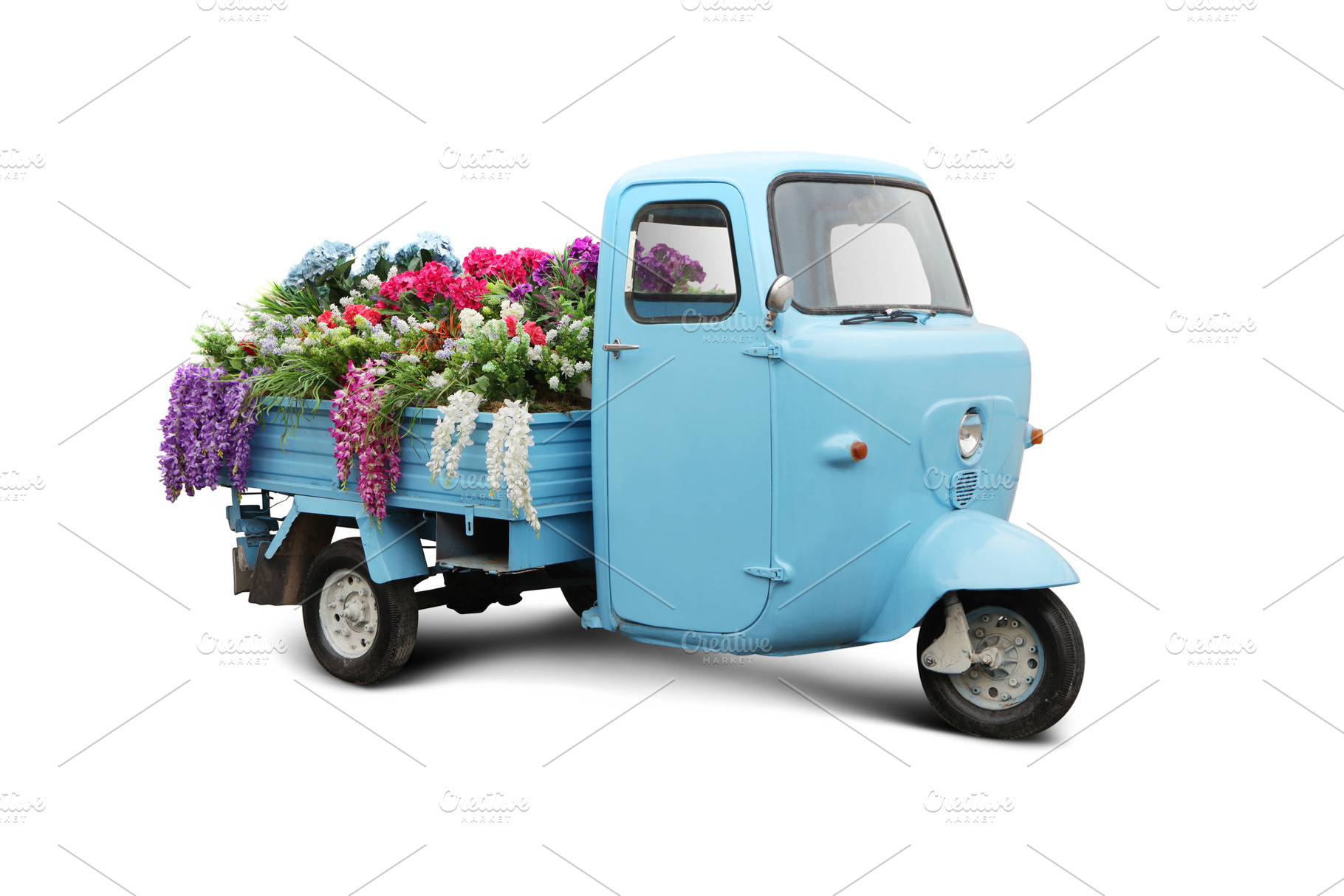 Vintage trike with flowers stock photo containing flowers and delivery, a Transportation Photo by Anton_Sokolov