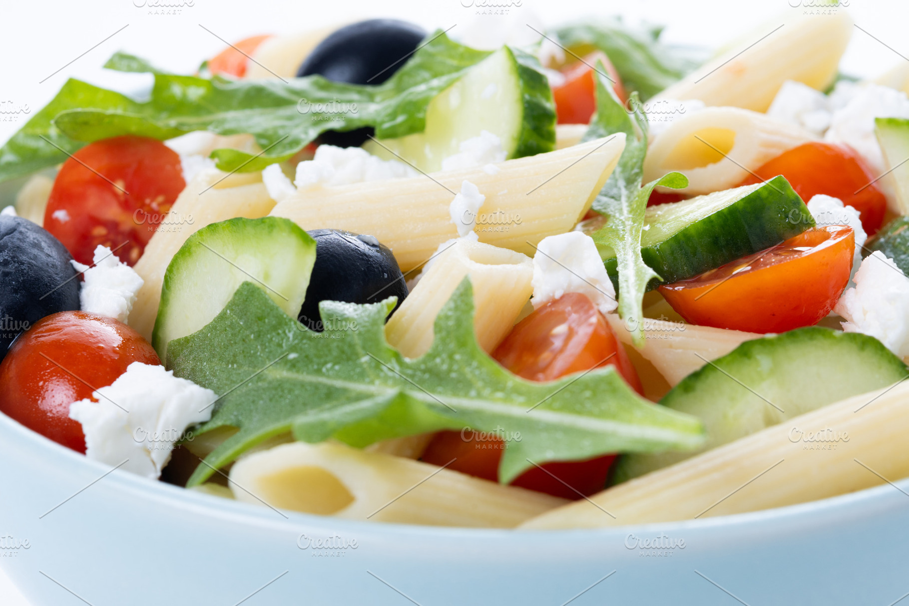 Mediterranean Pasta Salad with Fresh Vegetables and Herbs isolated on white bac, a Food & Drink Photo by etorres69