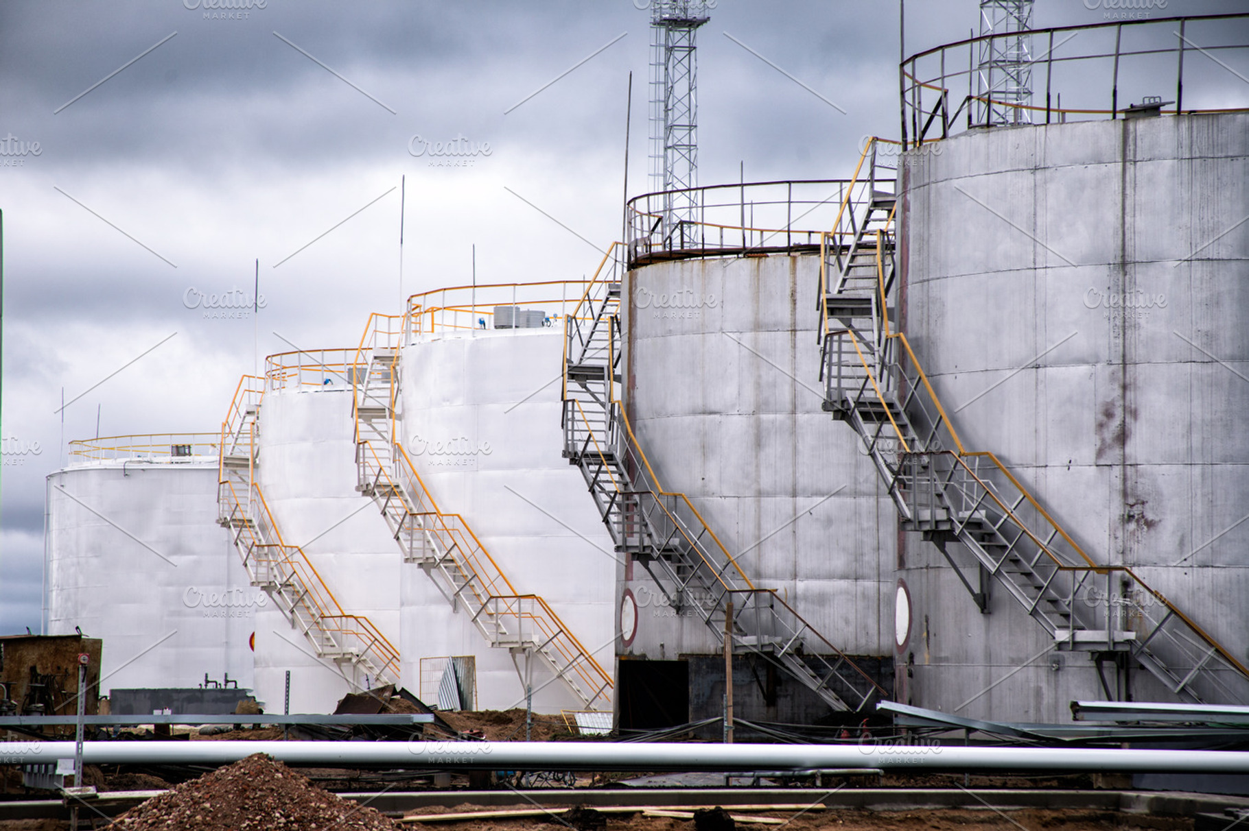 Large oil tank in industrial plant featuring oil, tank, and storage, an Industrial Photo by UltraShop