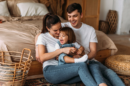 Portrait of a happy young family, a Person Photo by SOTNIKOV_MISHA