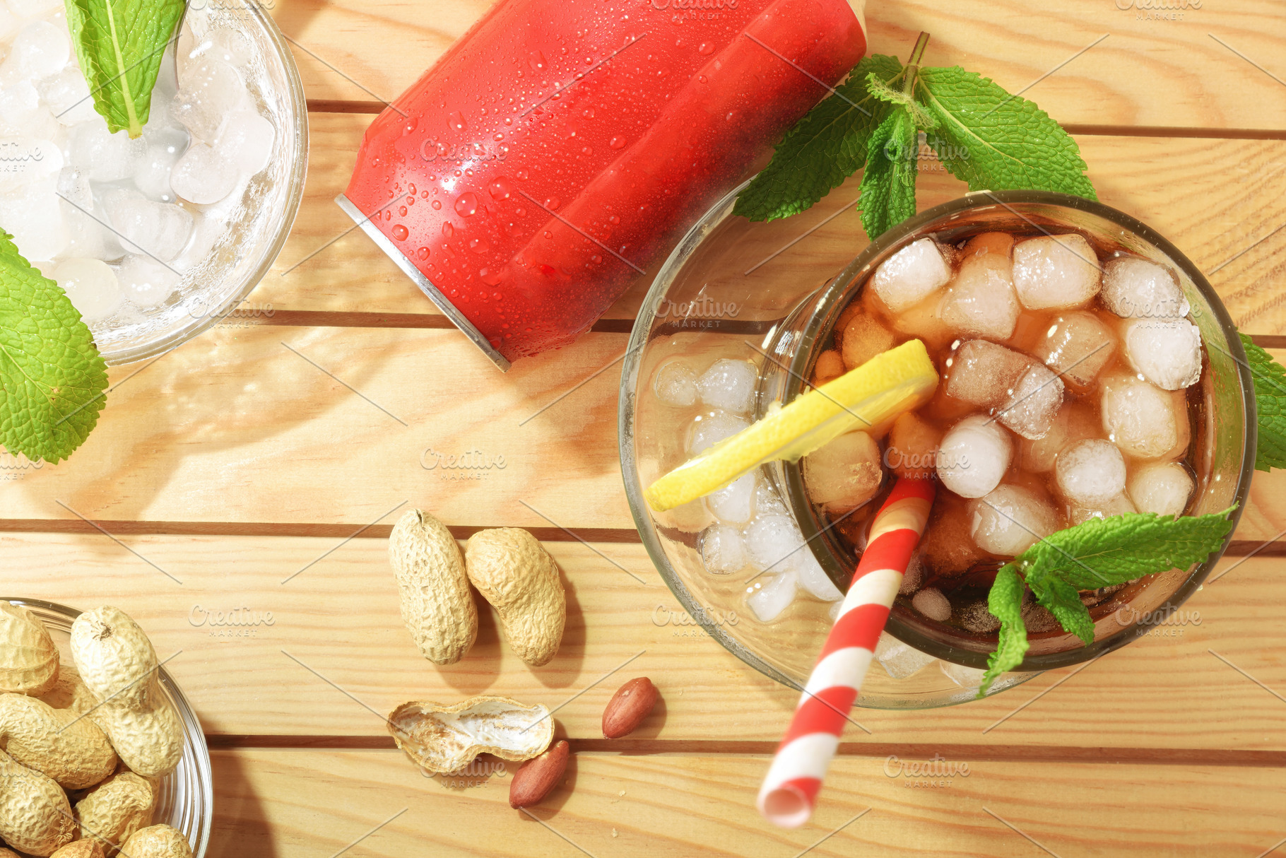 Cola soda on wooden table with peanuts and mint leaves, a Food & Drink Photo by Davizro's Market